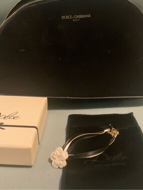 Dolce and Gabbana black and Gold Ribbon Wristlet White flower w pouch